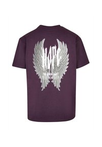 Lila Baumwoll-T-Shirt mit einem großen weißen grafischen Design von Flügeln und dem Wort "HOFFNUNG" darunter steht der Text "DAS LEUCHTENDEN LICHT".
