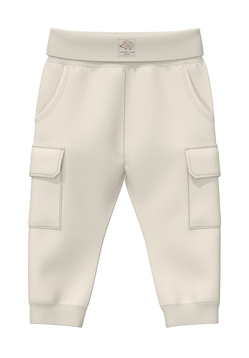 Kremne hlače s cargo krojem in mehko teksturo, opremljene z dvema stranskima žepoma in dvema cargo žepoma, elastičnim pasom in rebrastimi manšetami.