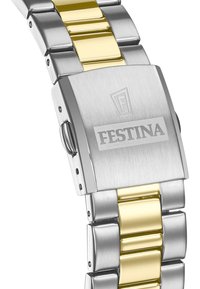 Metalna ura s srebrnim in zlatim tonom, s brušenimi in sijočimi členki. Ima kvadratno zaponko z graviranim logotipom "FESTINA".