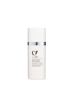 Brightening moisturiser in a white cylindrical bottle with silver accents. Label features black text, highlighting organic ingredients and brand name.