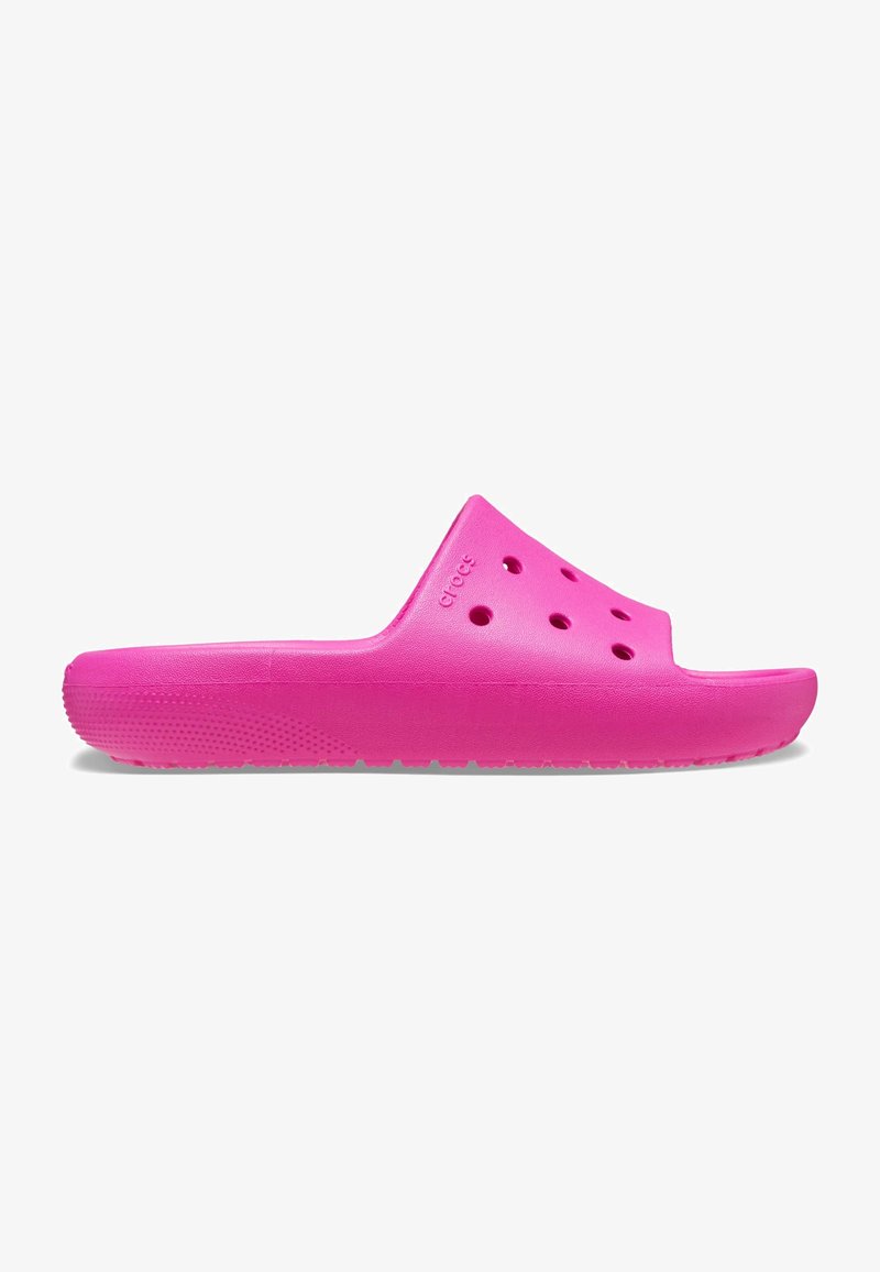 Bright pink slide sandal made of lightweight material, features open toe, ventilation holes, and a textured sole for grip.