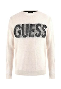 Maglione beige chiaro con il logo nero "GUESS" sulla parte frontale. Collo rotondo, polsini e orlo a costine. Morbida texture lavorata a maglia.