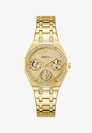 Relógio de pulso Guess em tom dourado com mostrador cravejado de cristais, três submostradores para 24 horas, dia e data, e uma bracelete de metal dourado.