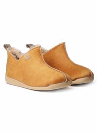 Yellow suede slippers with a soft, beige fur lining and a low, tan rubber sole. Slip-on design with rounded toes and stitched accents.