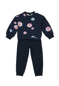 Sweatshirt et pantalon de sport bleu marine avec des motifs floraux en rose, blanc et turquoise. Comprend un col rond et des poignets élastiques sur le sweat et le pantalon.