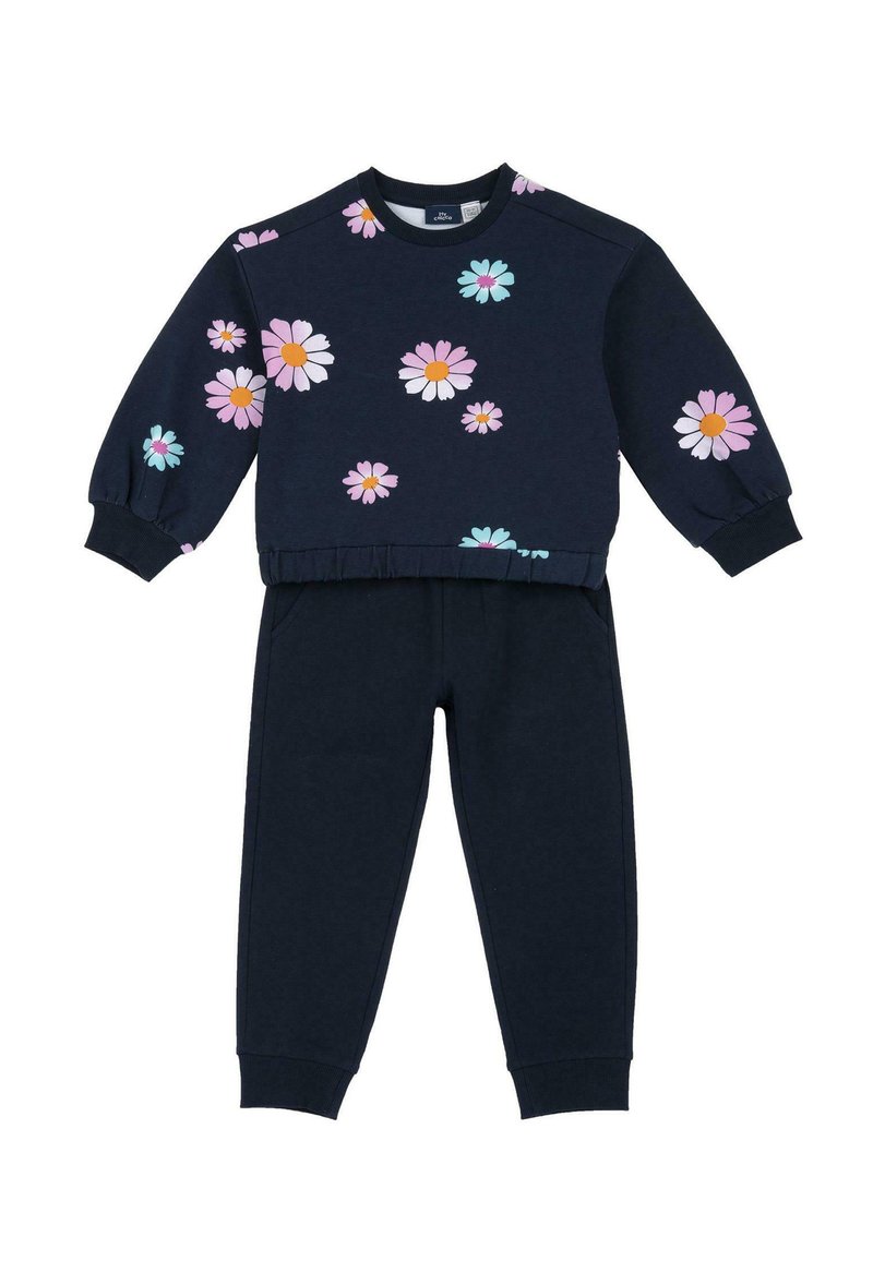 Sweatshirt et pantalon de sport bleu marine avec des motifs floraux en rose, blanc et turquoise. Comprend un col rond et des poignets élastiques sur le sweat et le pantalon.