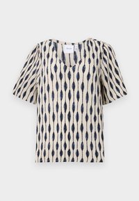 Haut crème à manches courtes avec un décolleté en V, présentant un motif distinctif de feuilles allongées en bleu marine et noir sur le tissu.
