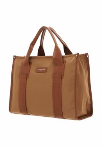 Sac tote en textile marron avec poignes doubles, présentant une forme rectangulaire, des coutures renforcées, et un patch en cuir marqué à l'avant.
