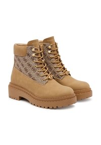 Stivaletti alla caviglia in suede color tan con una tomaia in tessuto logato testurizzato, punta rotonda, suola chunky e lacci frontali con occhielli in metallo.