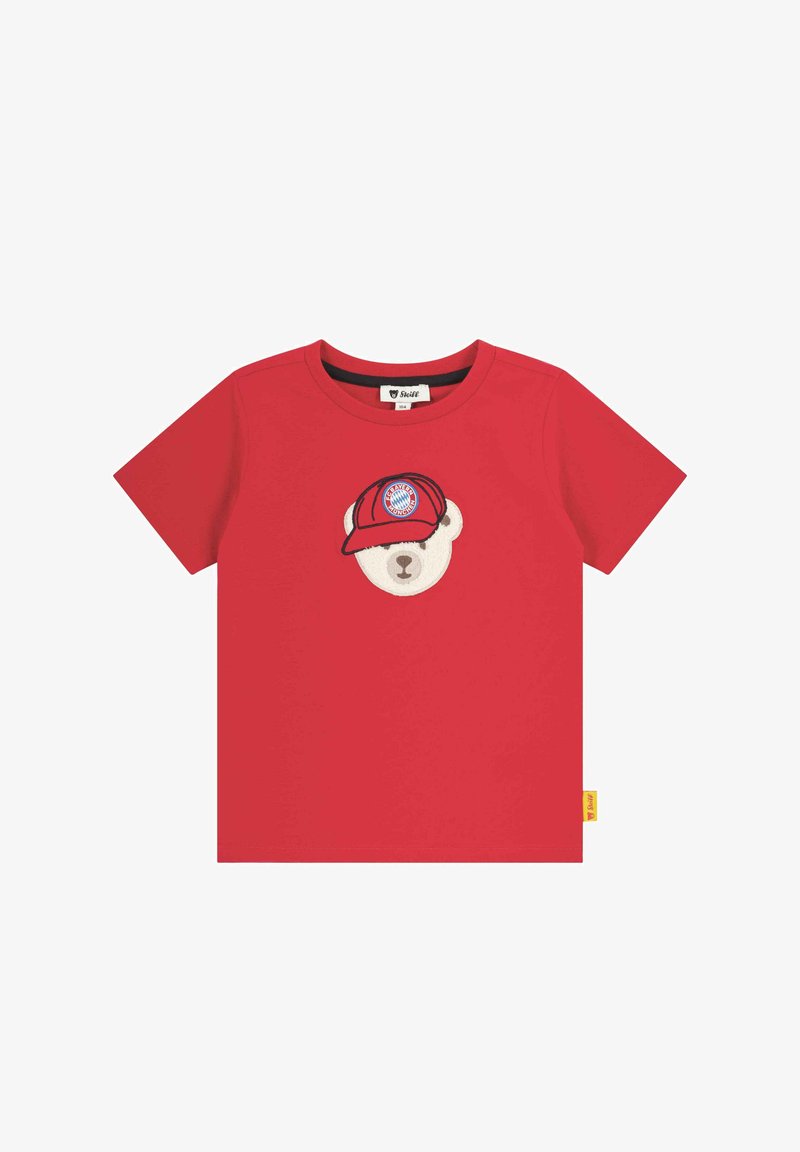 Red cotton t-shirt featuring an embroidered bear head with a cap, displaying a logo. Short sleeves and a crew neck design. Yellow tag on the side.