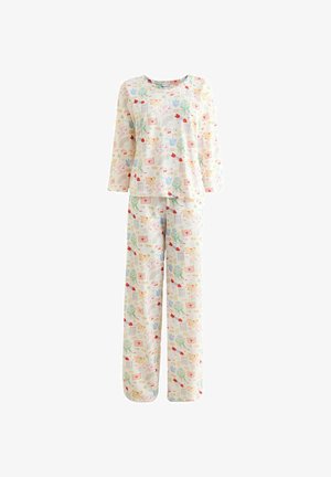 Gyermek hosszú ujjú pizsama, pasztell színű szívek, virágok, kártyák és kupidók mintával, krémszínű háttéren.