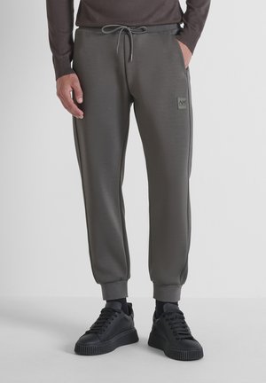 Grijze joggingsbroeken met een slim fit, gemaakt van zacht materiaal, met elastische manchetten, zijzakken en een klein logo-embleem.