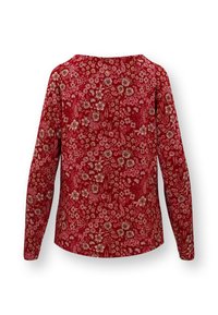 Rode shirt met lange mouwen, versierd met een bloemenpatroon in tinten van roze en crème. Zachte stof, ronde halslijn en casual pasvorm.