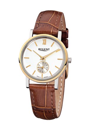 Montre ronde en argent avec un cadran blanc et des accents dorés. Bracelet en cuir marron avec un motif crocodile. Sous-cadran en bas.
