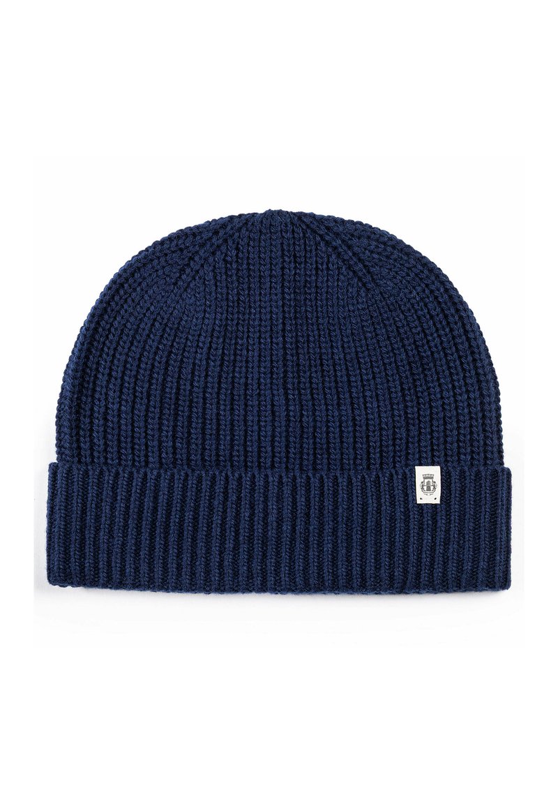 Navy blue knitted beanie with ribbed texture and a folded cuff. Small logo tag on the front adds detail. Elastic material for flexibility.