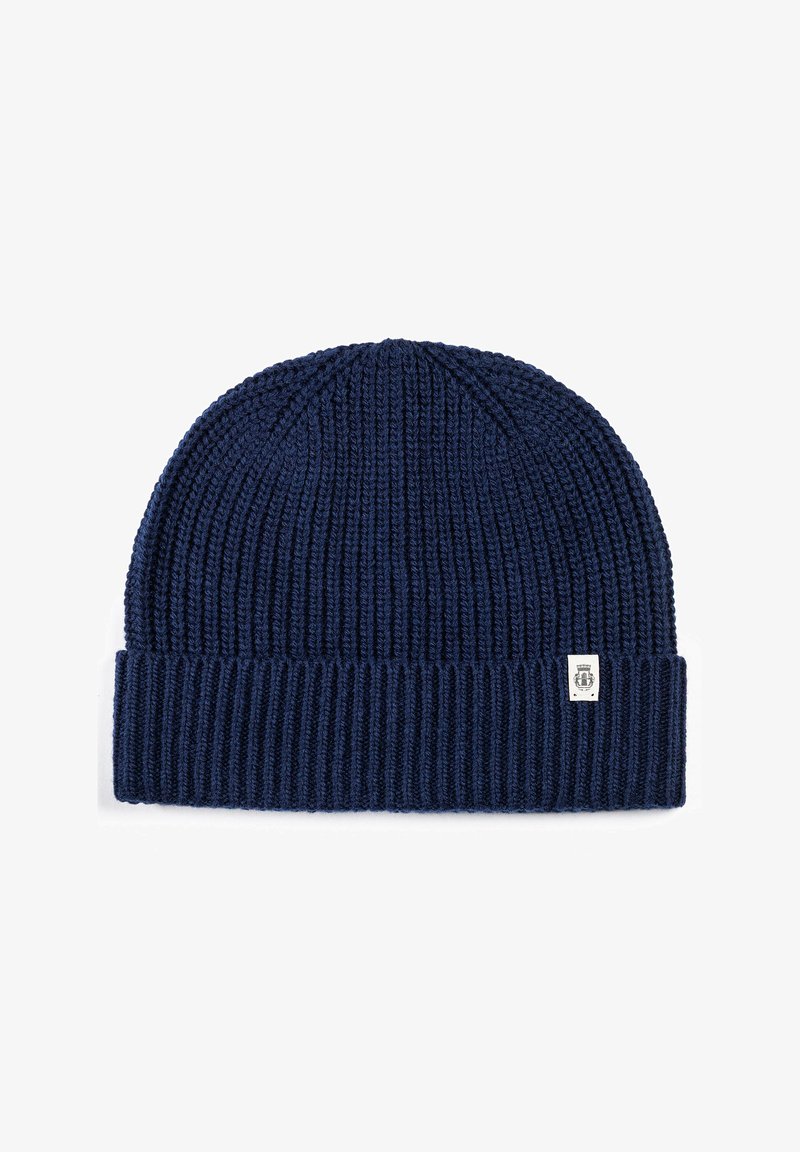 Navy blue knitted beanie with ribbed texture and a folded cuff. Small logo tag on the front adds detail. Elastic material for flexibility.