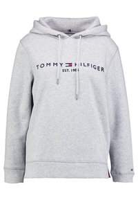 Jasnoszara bluza z kapturem Tommy Hilfiger z logo z przodu, sznurkiem przy kapturze, długimi rękawami oraz małym detalem w postaci flagi na mankiecie i dolnym brzegu.