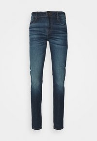 Slim fit sötétkék farmernadrág elhasználódott hatással. Anyaga: pamut keverék. Öt zsebbel és gombos záródással rendelkezik.