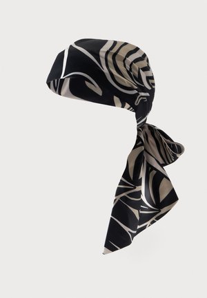 Čierno-béžový vzorovaný hodvábny šál viazaný zospodu s abstraktnými zakrivenými a lineárnymi tvarmi na jednoliatej pozadi.