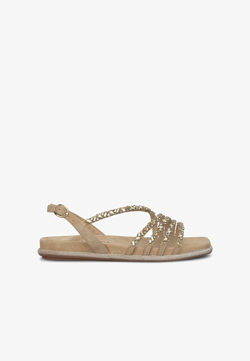 Beżowe sandały z wieloma wąskimi paskami ozdobionymi przezroczystymi kamieniami. Posiadają teksturowaną podeszwę i regulowany pasek na kostkę.