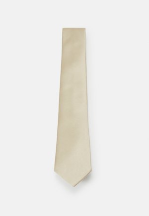 Lichtbeige stropdas met een subtiel diagonaal streepjespatroon, gemaakt van soepel materiaal, met een taps toelopende punt en een constante breedte.