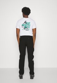 The North Face Ulkohousut - black