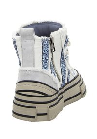 White ankle boot with blue glitter stripes, silver accents, and textured fabric. Features a side zipper and layered sole with black stripes.