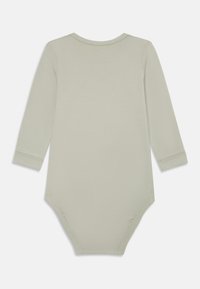 Hellgrüner Langarm-Body mit Rundhalsausschnitt und Druckknöpfen am unteren Ende. Aus weichem, dehnbarem Baumwollstoff gefertigt. Schlichtes Design.