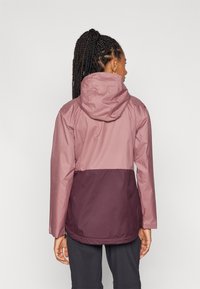 Water-resistant jacket in two-tone mauve and burgundy, featuring a hood, long sleeves, and a relaxed fit for comfort.