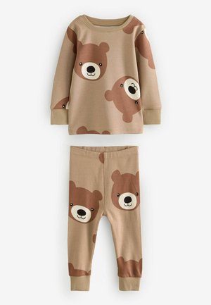 Beige Schlafanzug-Set bestehend aus einem Langarmoberteil und einer Hose, beide mit Braunbär-Gesichtern. Hergestellt aus weichem, dehnbarem Stoff mit gerippten Bündchen.