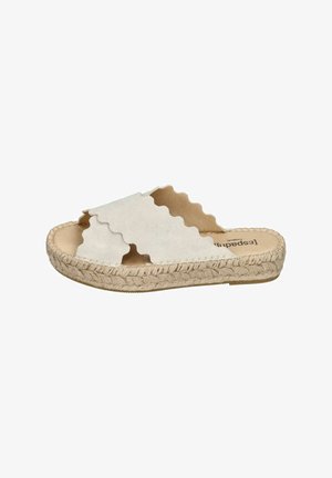 White suede slide sandals with scalloped straps, featuring a woven jute sole and a beige inner lining. Flat design with no visible hardware.