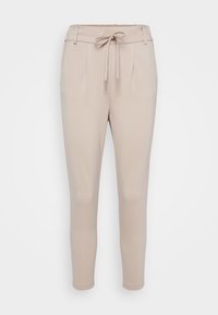 Beżowe spodnie zwężane z elastycznym pasem ze sznurkiem, plisowanym przodem i elastycznym materiałem. Posiadają gładką fakturę i mankiety na kostkach.