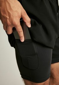 Next 2-IN-1 TRAINING - Shorts - black