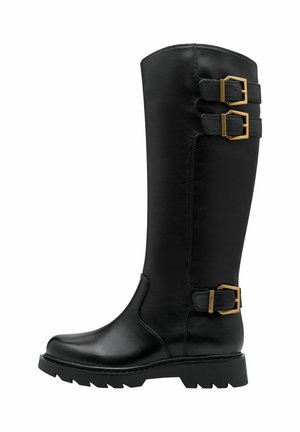 Bottes noires montantes en cuir lisse, avec deux boucles dorées sur les côtés et une semelle robuste pour une meilleure adhérence.