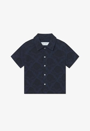 Granatowa koszula z krótkim rękawem w kwiatowy wzór, wykonana z lekkiego materiału. Posiada kołnierzyk zapinany na guziki oraz zapięcie na guziki z przodu.