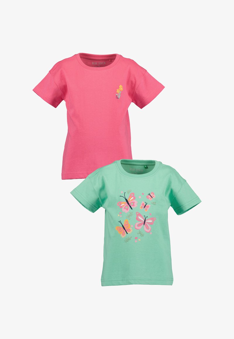 Deux t-shirts en coton : l'un rose avec un petit motif de fleur, l'autre vert menthe orné de papillons colorés et de motifs floraux.