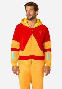 Red and orange plush onesie with a yellow hood, featuring blue arrow accents and a circular logo on the chest. Zipper front closure.