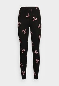 Leggings noirs avec un motif répétitif de cannes en sucre rouge et blanc. Fabriqués à partir d'un matériau extensible avec une taille confortable.