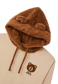 Felpa con fodera in pile marrone, corpo beige, con ricamo a forma di faccia d'orso e testo "RELAX MOOD ON", oltre a due orecchie pelose sul cappuccio.