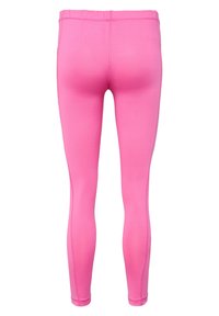 Leggings rose ajustés en tissu extensible, dotés d'une taille haute et d'un design sans couture. Texture lisse sans motifs ni éléments visibles.