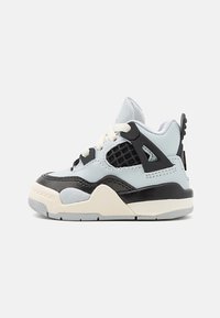 Blue and black toddler sneaker with mesh accents, textured overlay, and beige sole. Features white laces and a logo on the side.