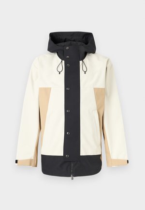 Biała, beżowa i czarna kurtka z kapturem, zapinana z przodu na zamek błyskawiczny i zatrzaski, z regulowanymi trokami kaptura oraz długimi rękawami z zapięciami na rzepy.