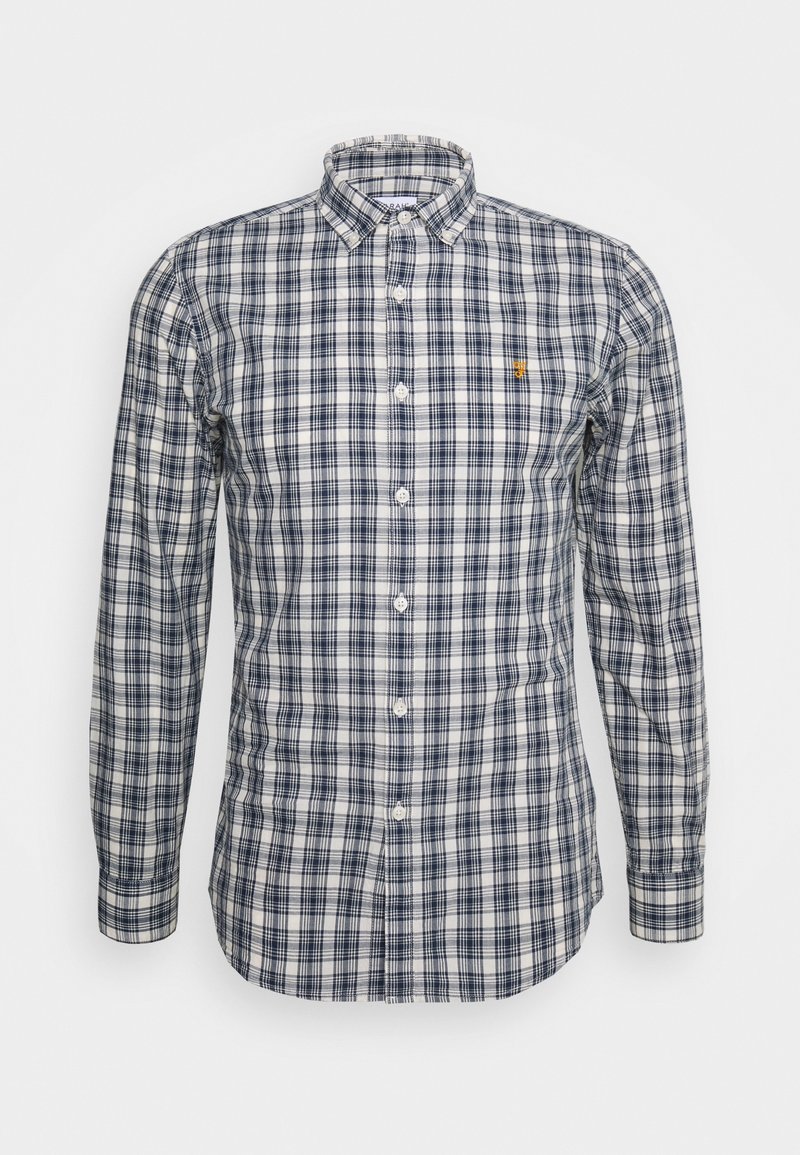 Chemise à manches longues boutonnée avec motif à carreaux bleu marine et blanc, col boutonné et petit logo brodé sur la poitrine.