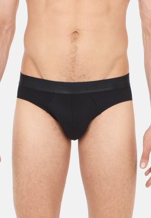 Zwarte katoenen boxershorts met een satijnen tailleband met reliëfbranding, ontworpen voor comfort en een strakke pasvorm, met een gladde textuur.