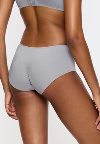 Gray seamless underwear with a smooth texture, featuring a low-rise design and gathered detailing at the back.