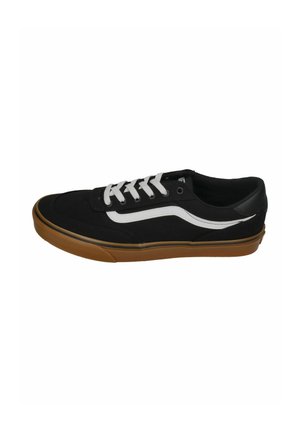 Black low-top sneaker with white side stripe, white laces, and gum rubber sole.