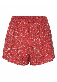 Shorts rouges à taille élastique avec un petit motif floral blanc et noir, coupe ample, tissu léger et style décontracté.