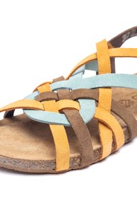 Suede sandals featuring intertwined straps in brown, blue, and orange, with a textured beige sole and open-toe design.