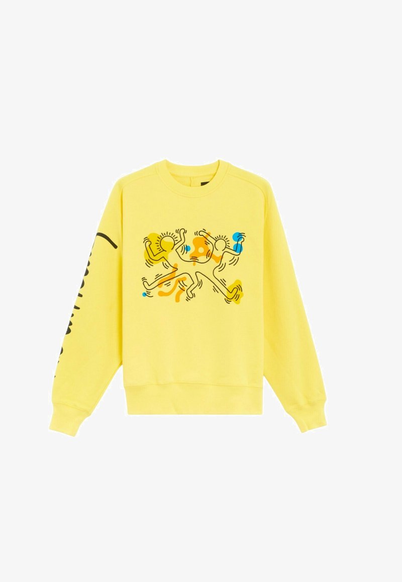 Felpa gialla con maniche lunghe e polsini a coste. Il design presenta figure astratte in arancione, blu e nero sul fronte.