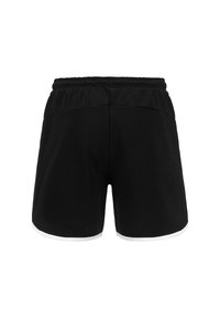 Pantaloni sportivi neri con vita elastica, bordi bianchi e una texture liscia, caratterizzati da un design semplice senza tasche visibili.